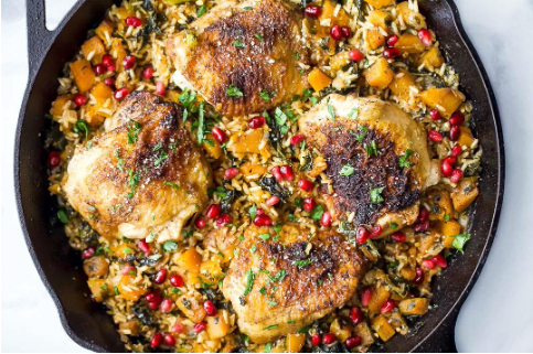 A pan of food with meat and riceAI-generated content may be incorrect.