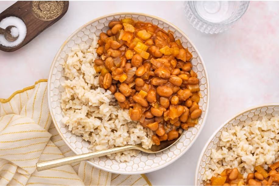 A bowl of beans and riceAI-generated content may be incorrect.