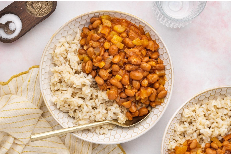 A bowl of beans and riceAI-generated content may be incorrect.