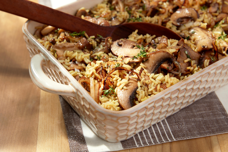 A bowl of rice and mushroomsAI-generated content may be incorrect.