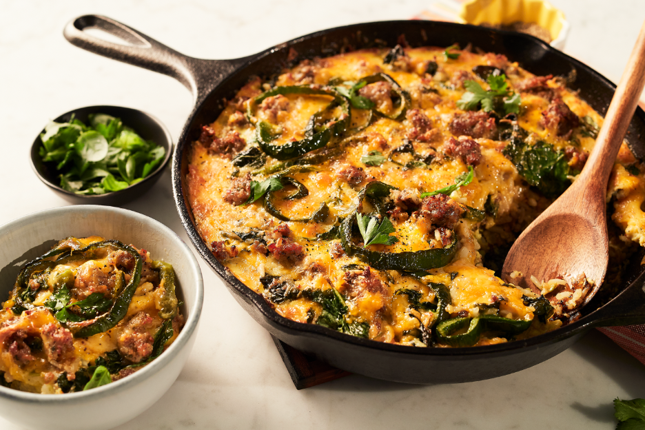 A skillet with meat and jalapeno peppers in itAI-generated content may be incorrect.