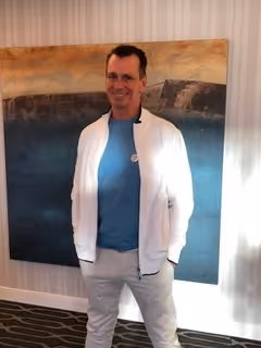 Bob posing in front of painting