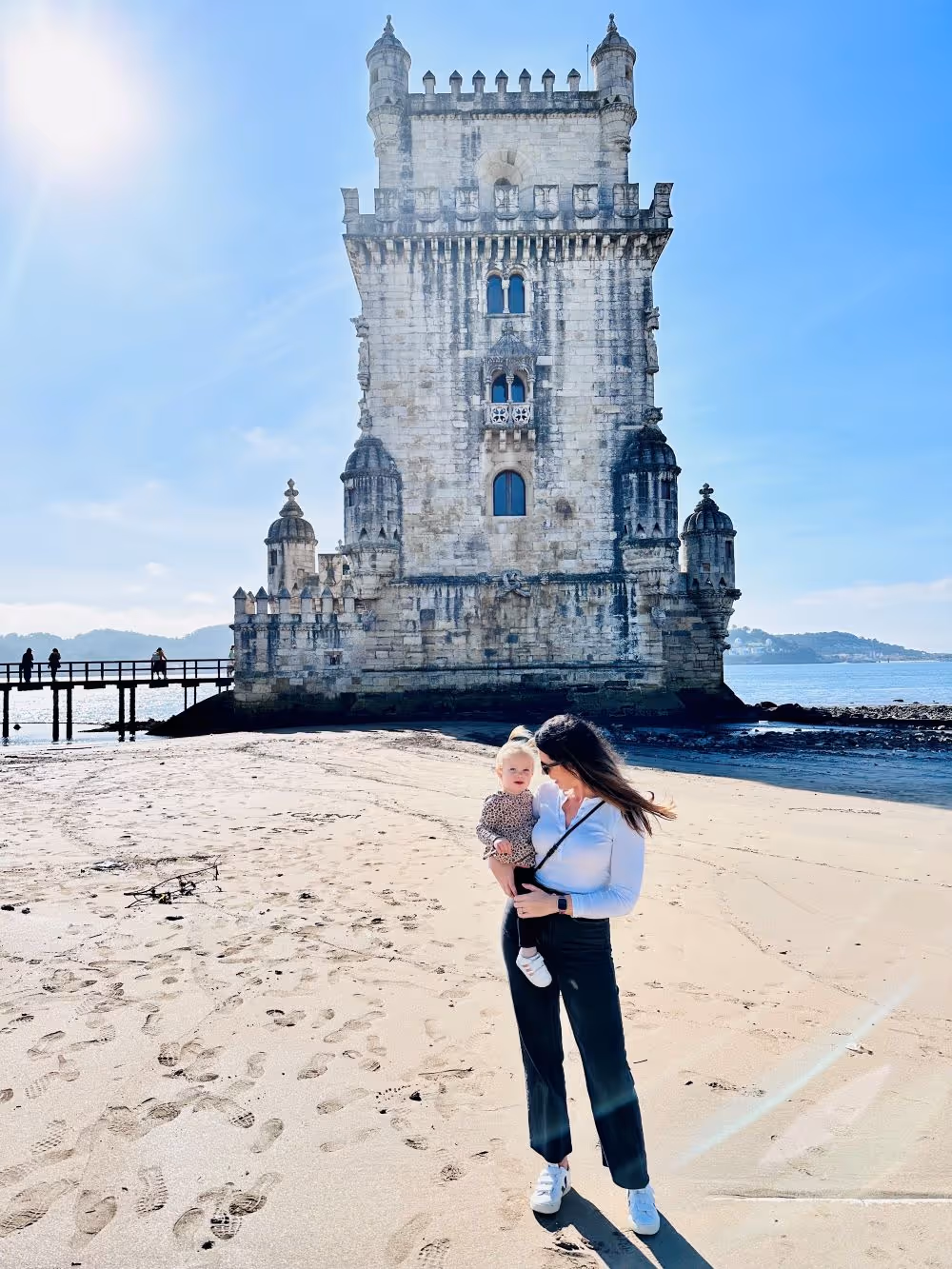 Nicole with daughter on a beach