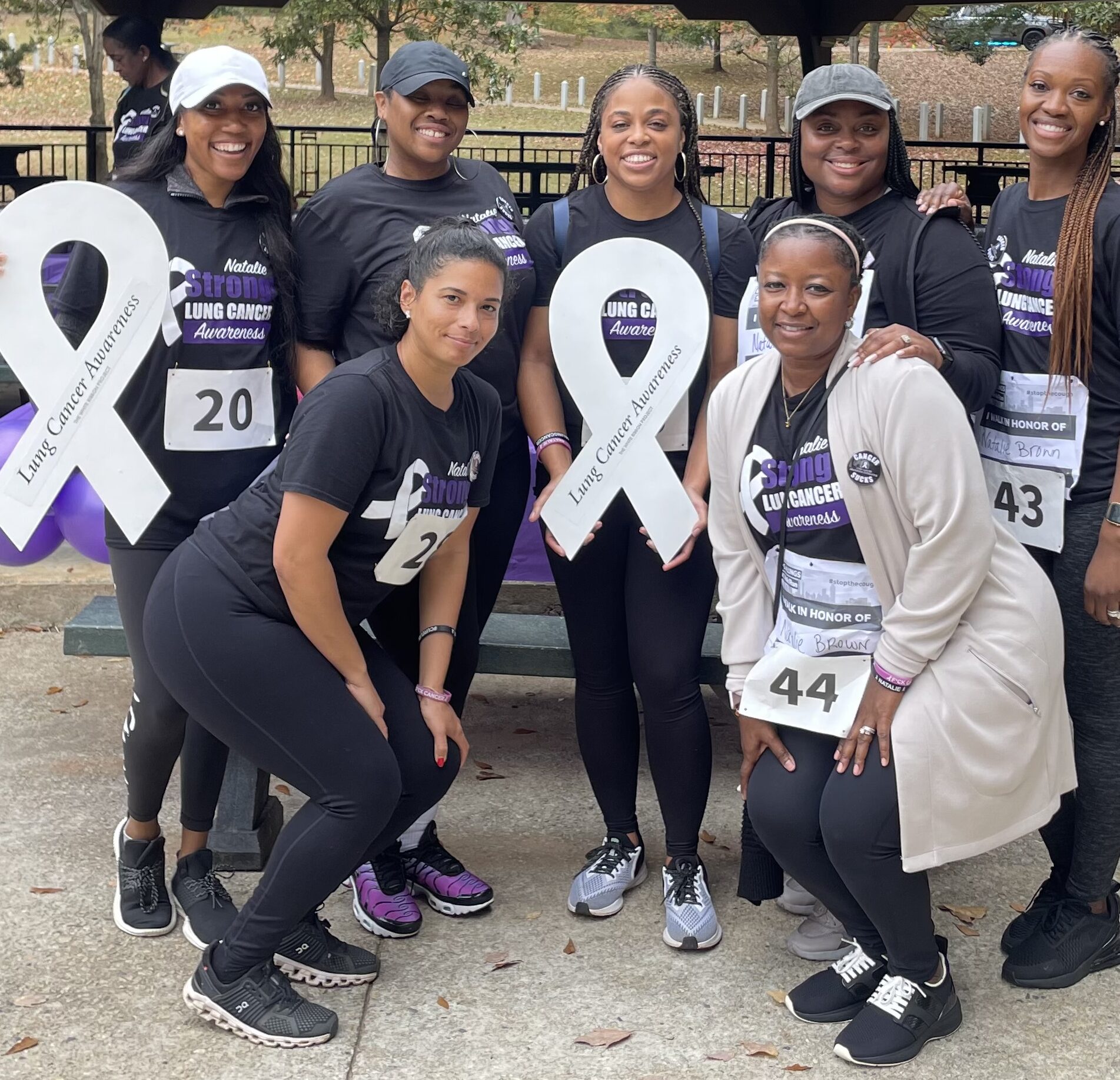 Natalie and friends with white ribbons