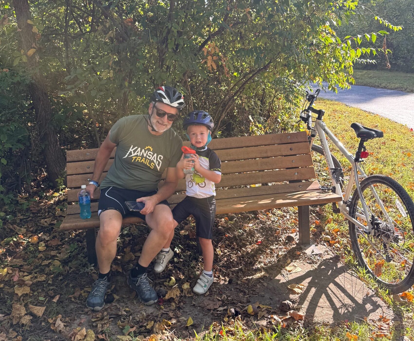 Mike with his grandson on a bench