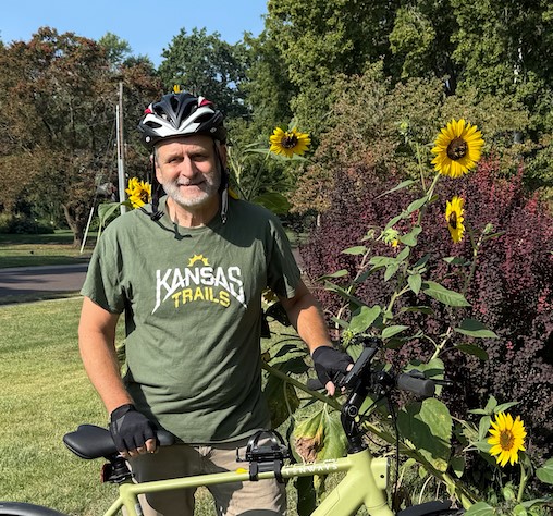 Mike with flowers and his bike