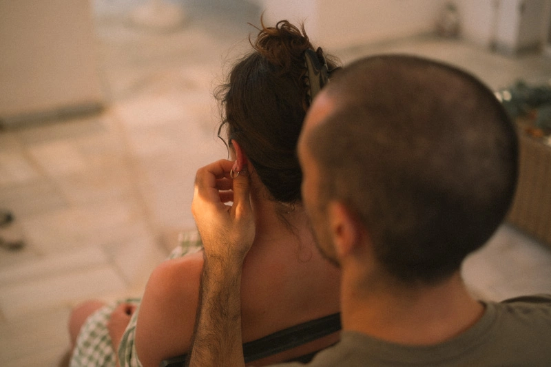 A husband giving massage to his pregnant wife