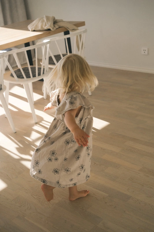 A daughter dancing during a family photoshoot 