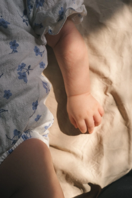 Close up of newborn baby hand in the sunlight