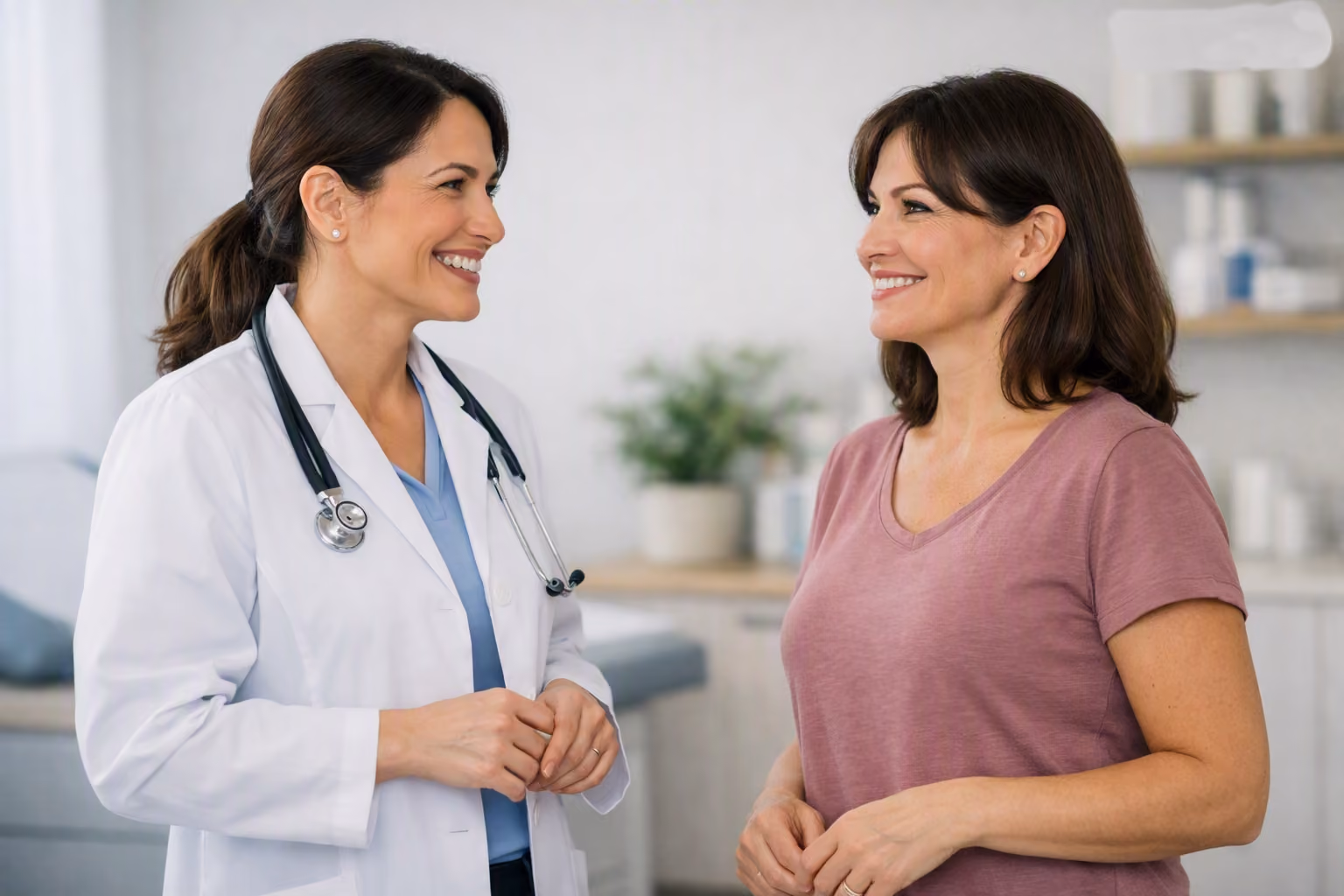 Doctor and young girl giving a fist bump in a bright medical office