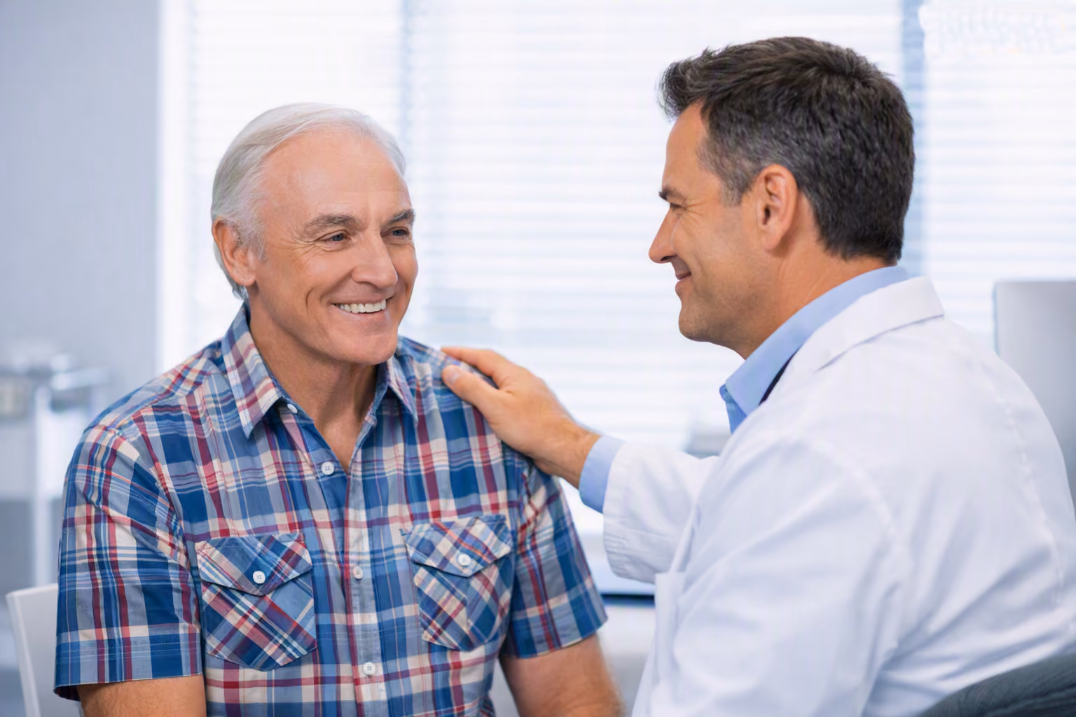 Doctor and young girl giving a fist bump in a bright medical office