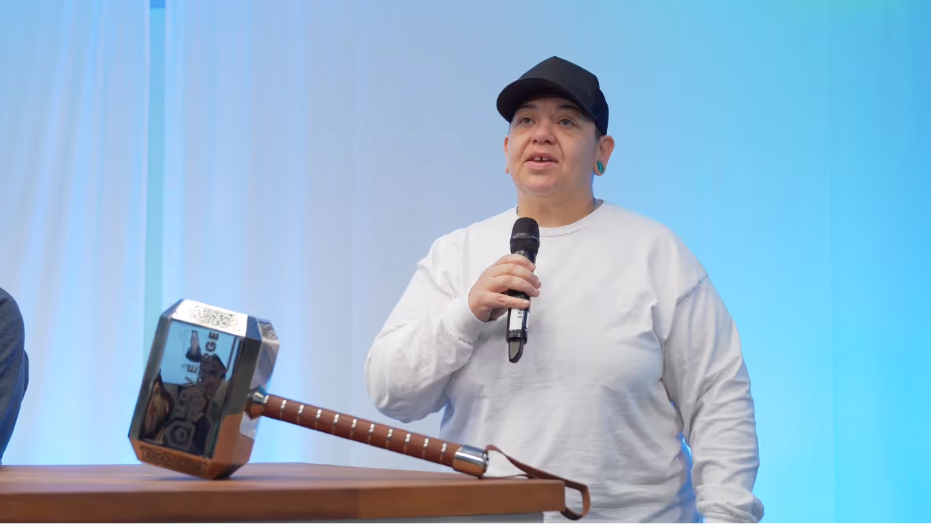 Roberta Cordato giving a speech at a quarterly kickoff after receiving an award. 