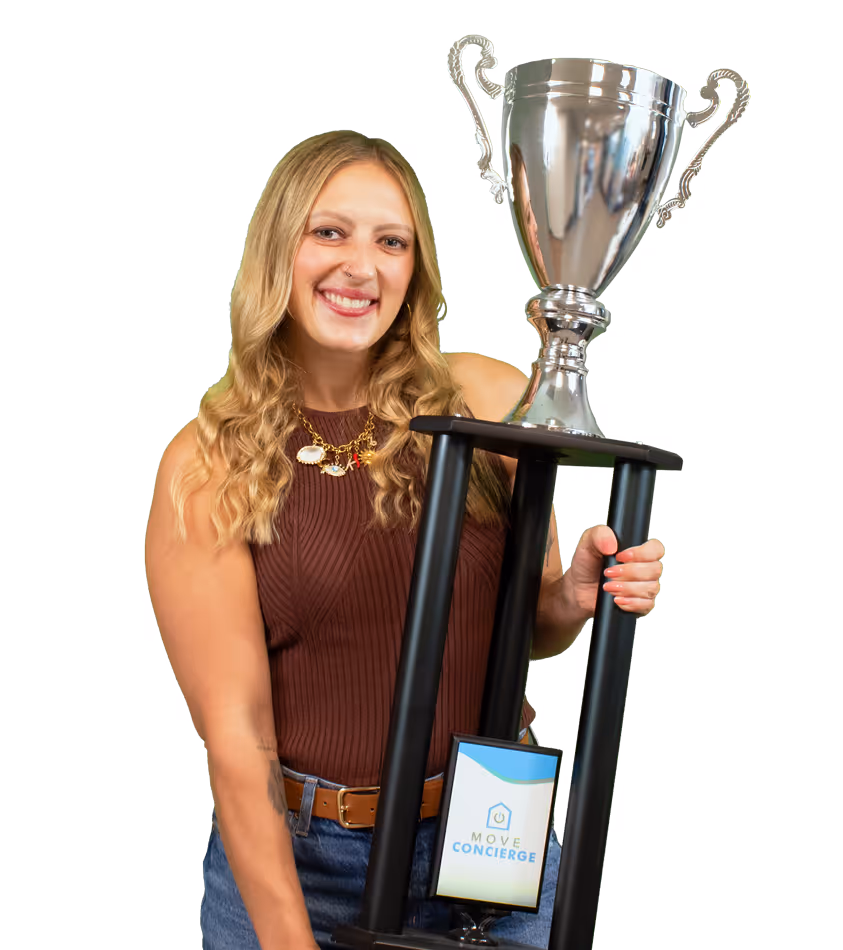 Kailey Byrd holding the being humble core value award.