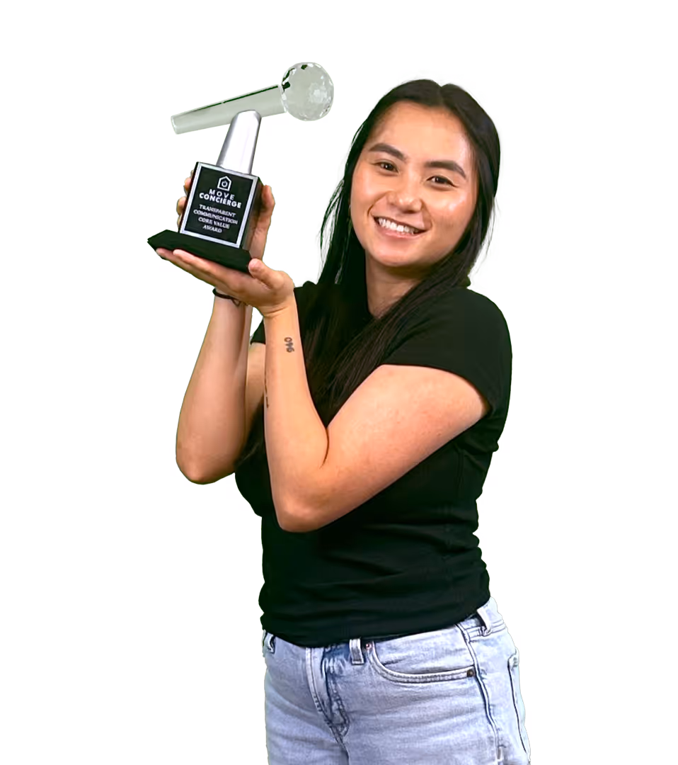 Zoie Layton holding the transparent communication core value award.