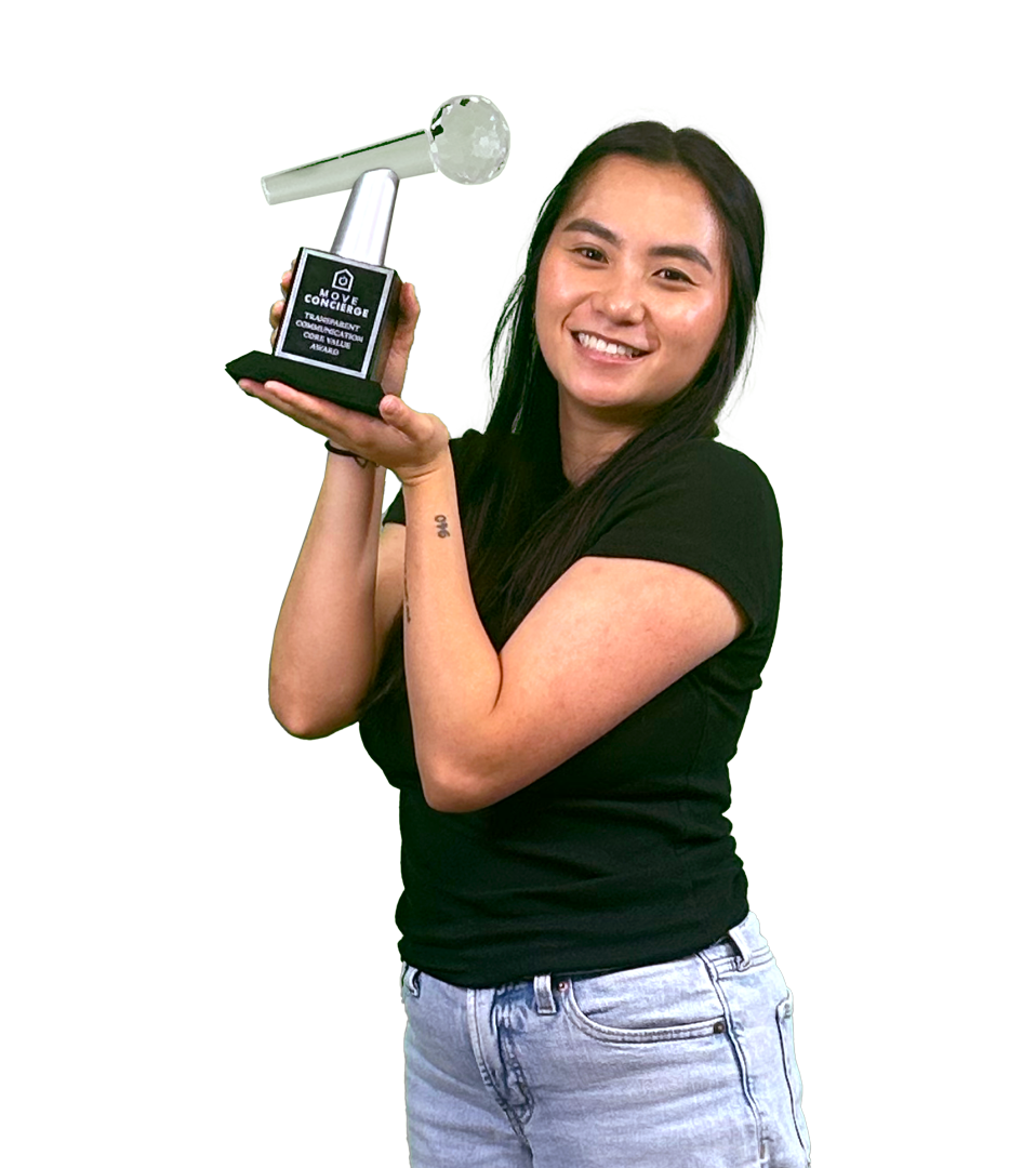 Zoie Layton holding the transparent communication core value award. 