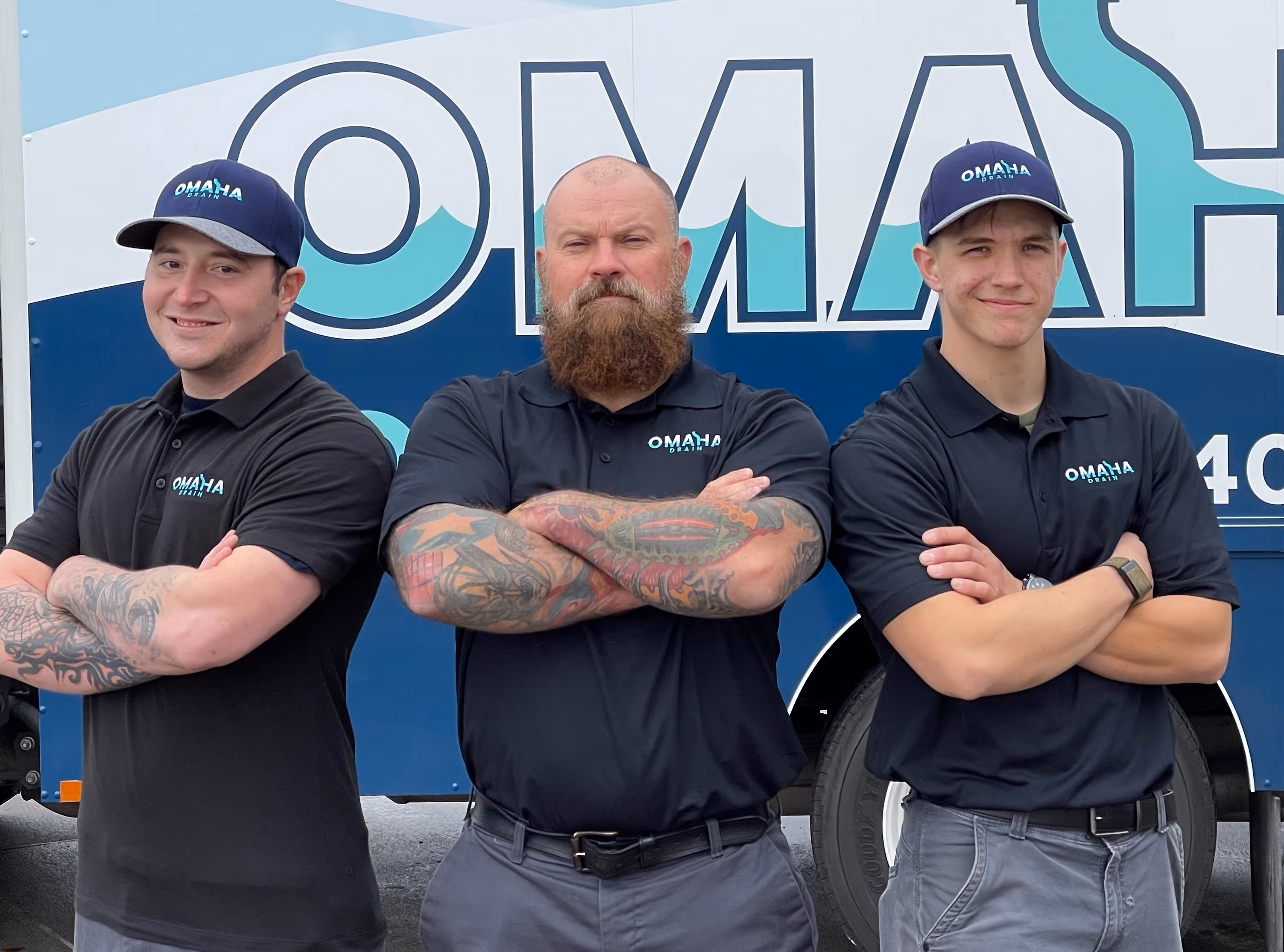 Two Omaha Drain technicians standing together