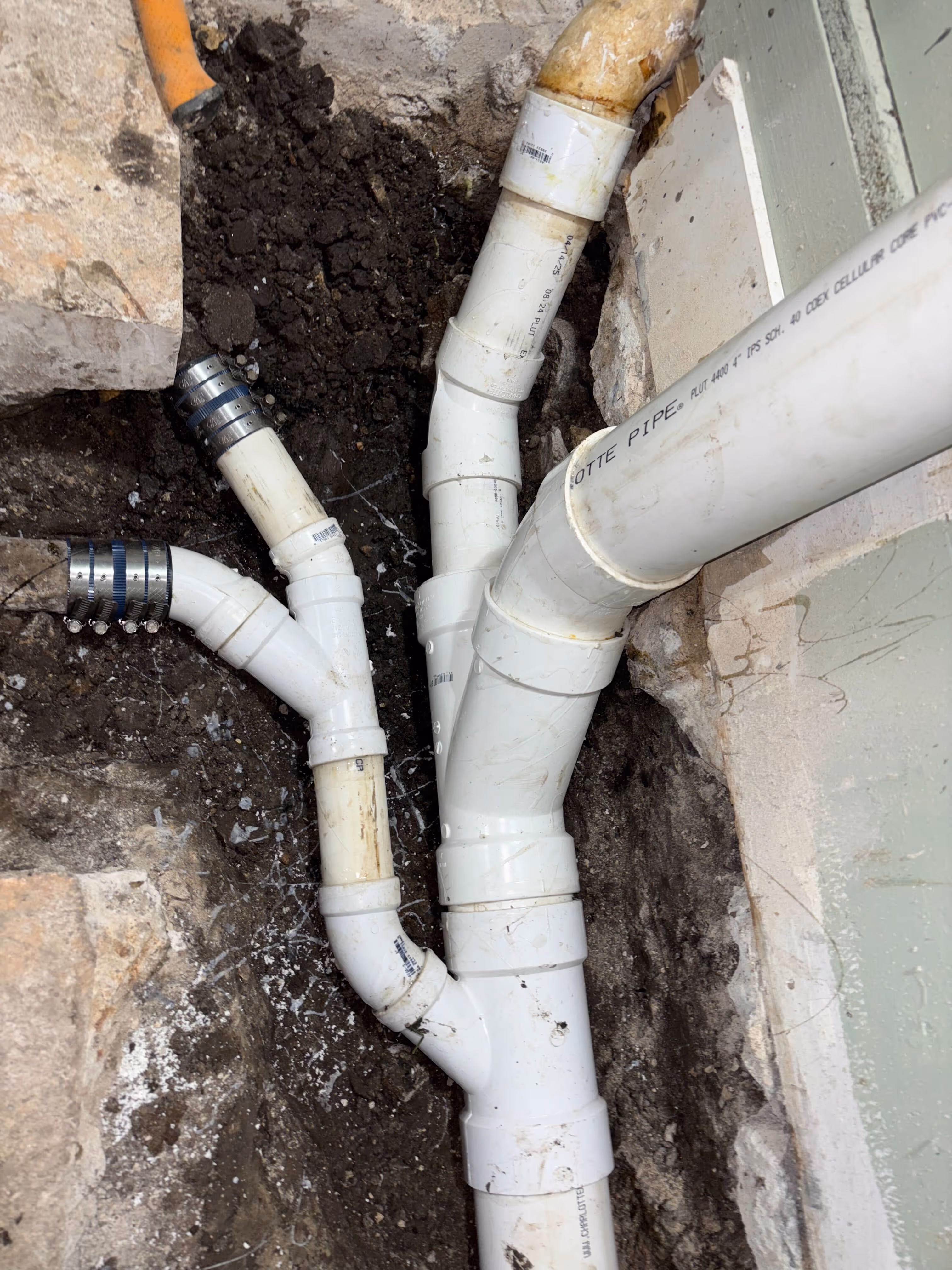 Technician working on interior drain replacement