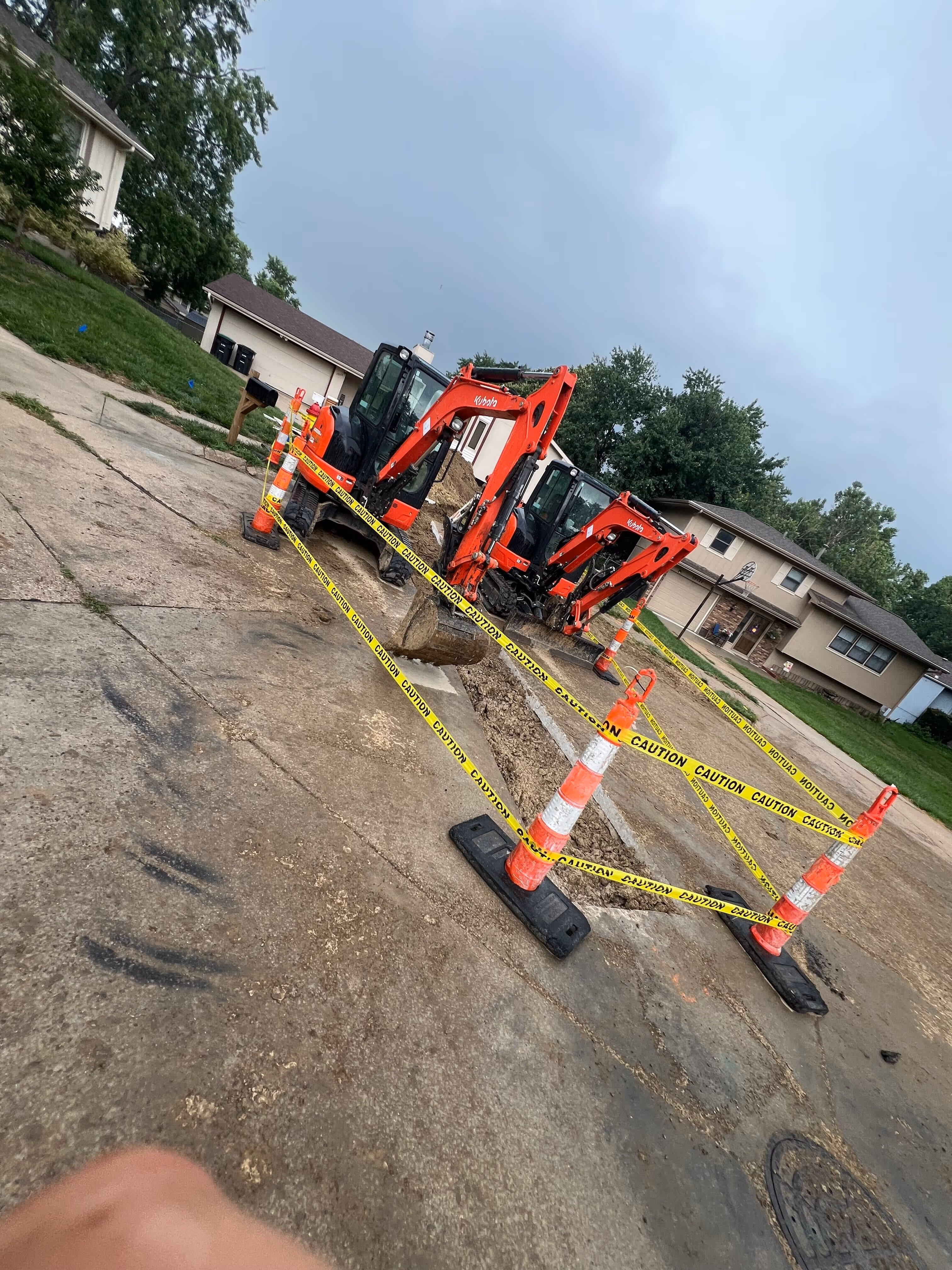 Backfilled trench in front yard after sewer repair