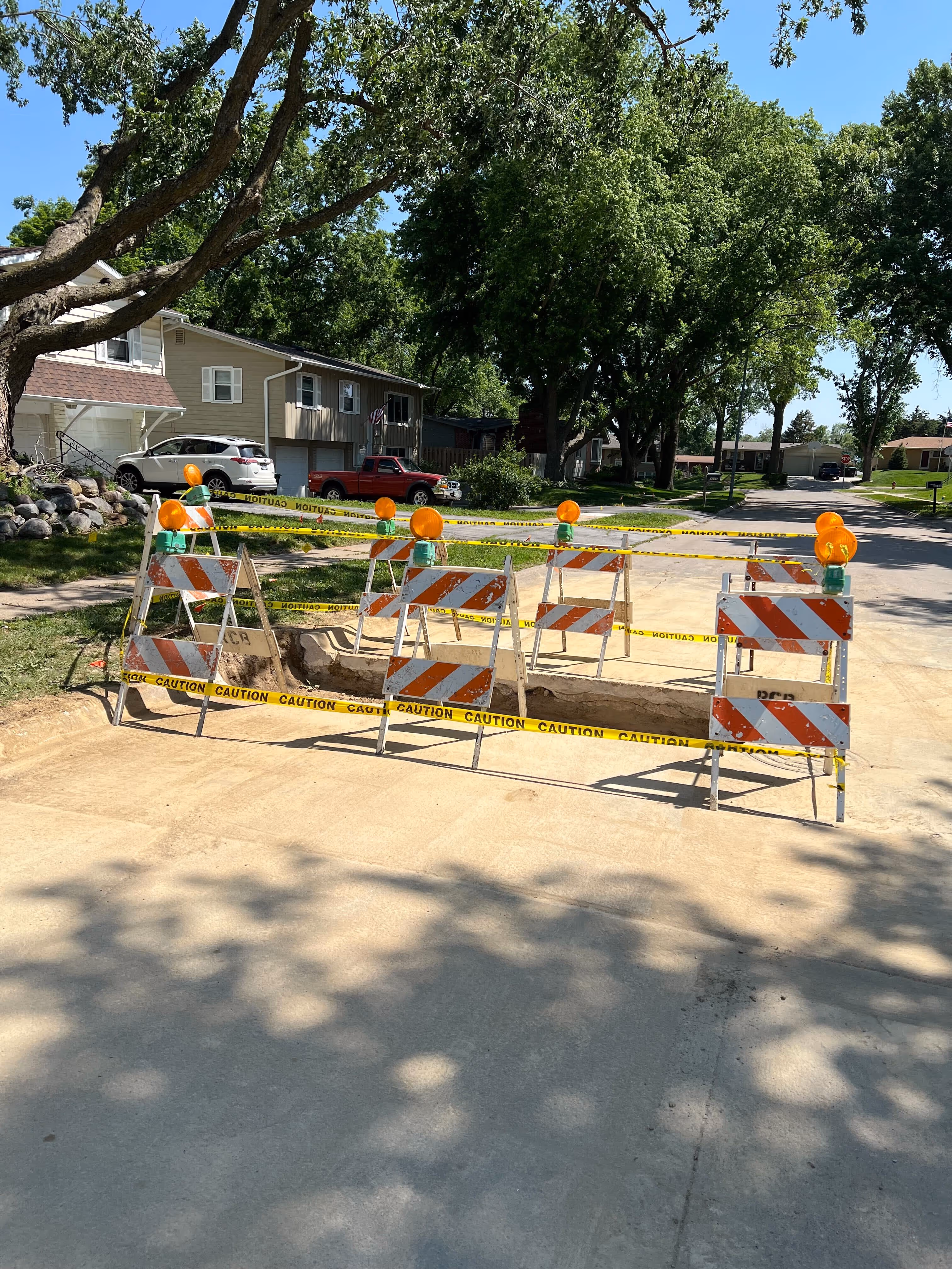 Omaha Drain crew replacing an outside sewer line in a yard