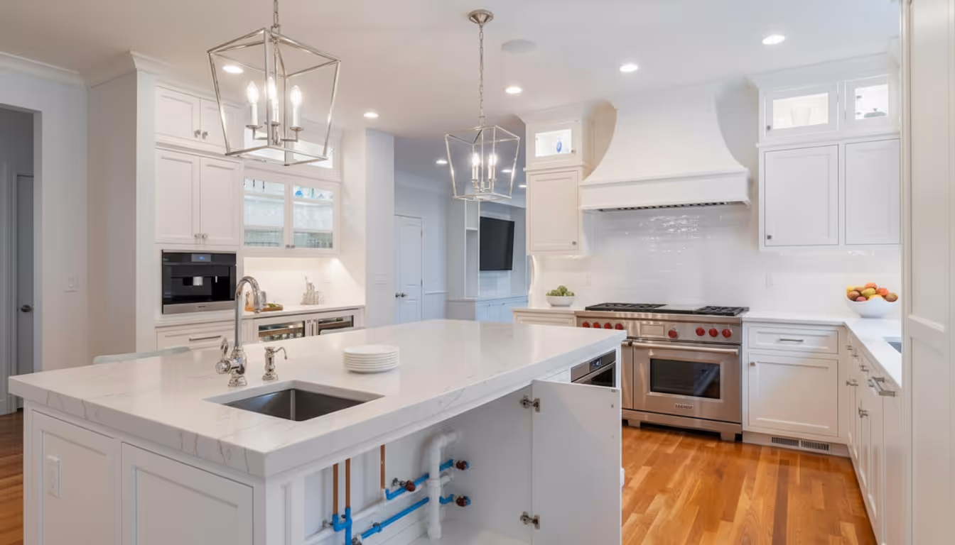 Technician repairing a kitchen sink and bathroom faucet in a home