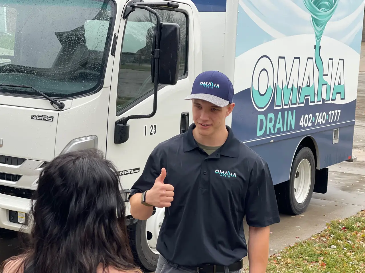 Omaha Drain technician greeting a homeowner at the door