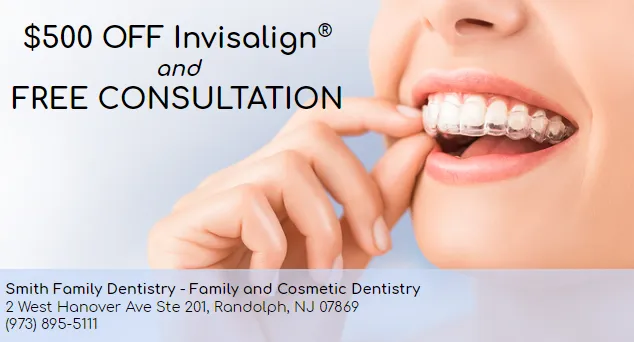Close-up of a person inserting a clear Invisalign aligner over their teeth with text offering $500 off Invisalign and free consultation, including Smith Family Dentistry contact details.