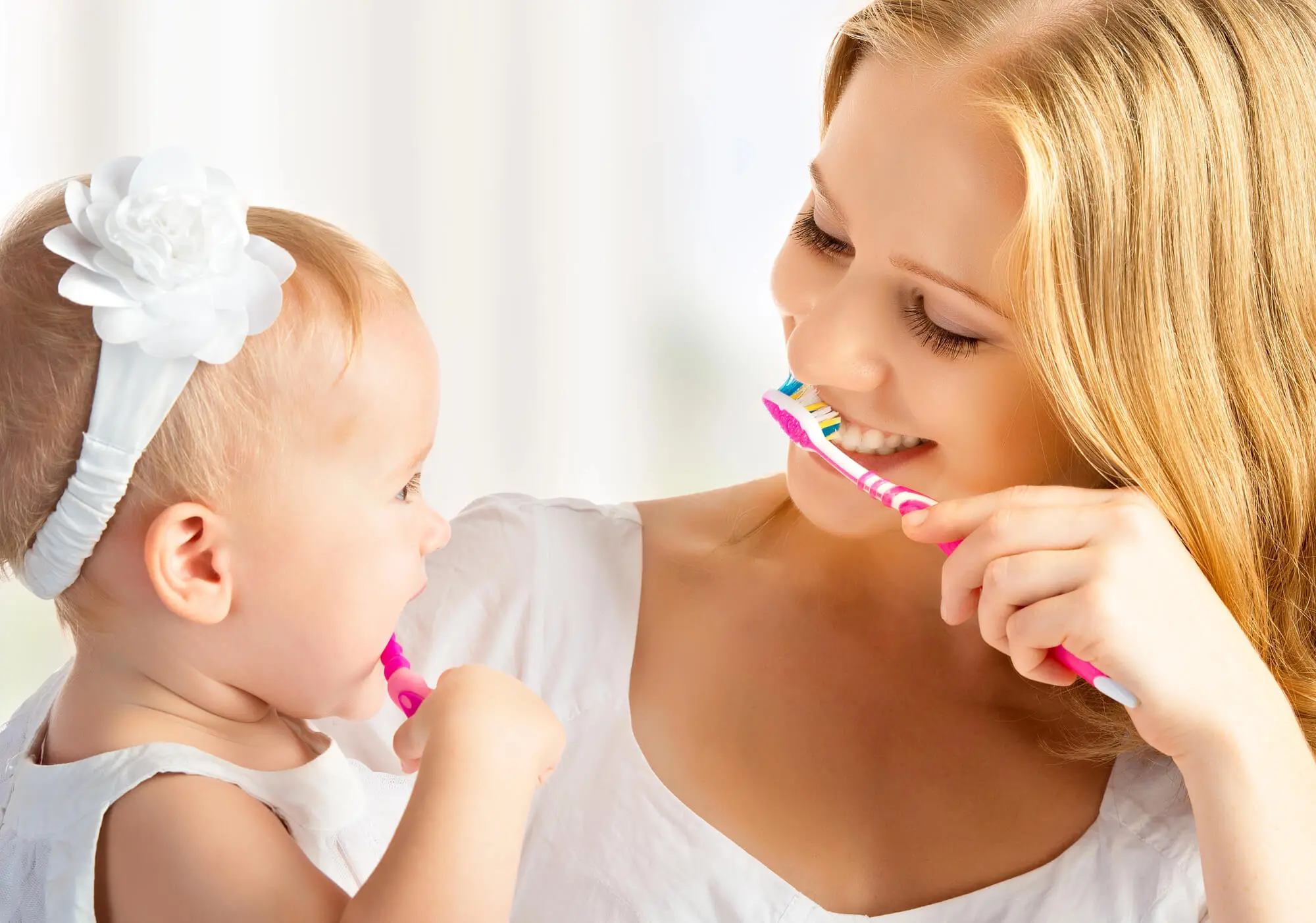 Mother and Daughter Cleaning Their Teeth After Visiting the Dentist in Randolph NJ