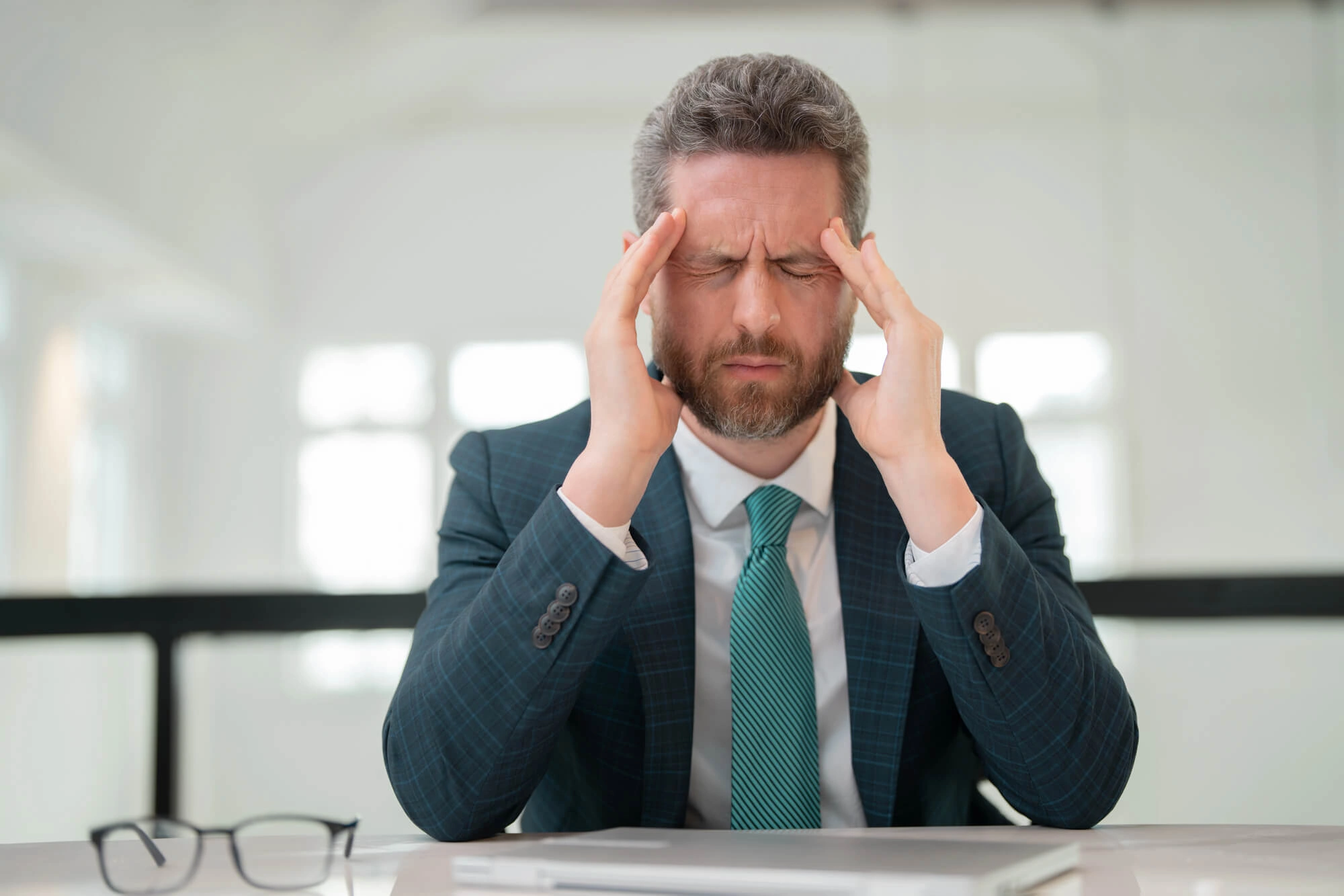 Man Experiencing Headache needs cosmetic dentistry randolph nj