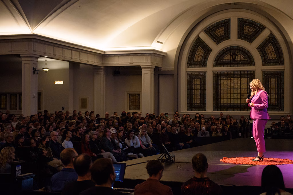image of young man holding microphone on stage