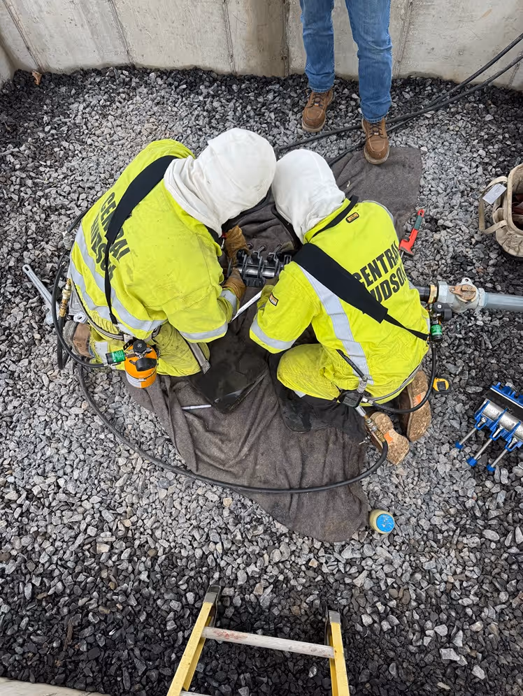two gas mechanics working