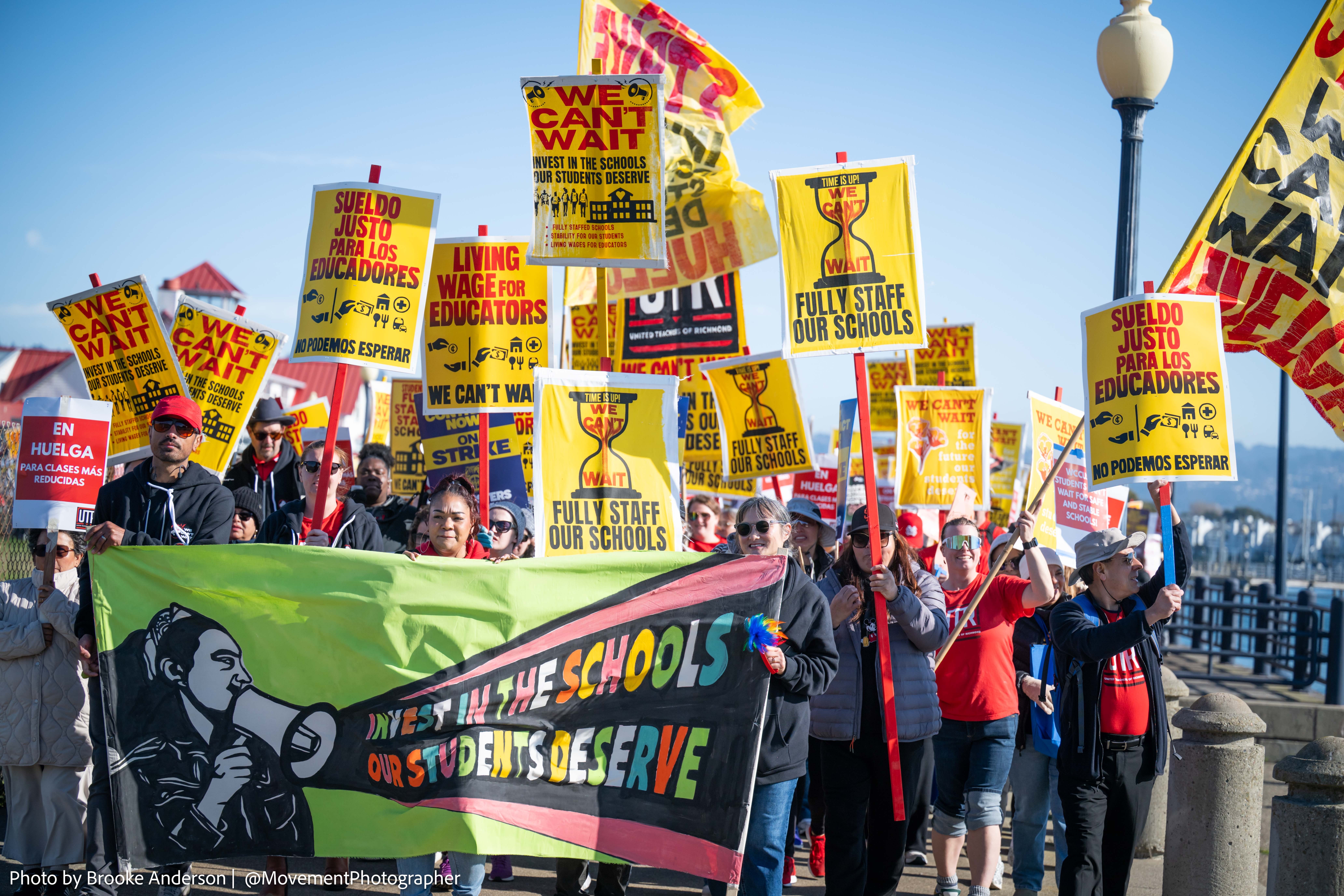 Two women in professional attire, illustrating the concept of following fashion trends for 2025.