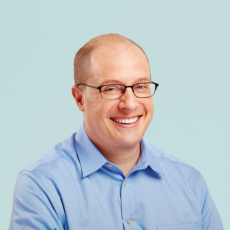 Portrait of Stacey Urry against a light background.