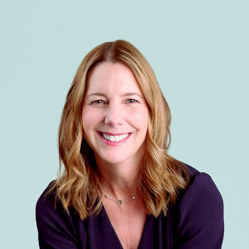 Portrait of Stacey Urry against a light background.