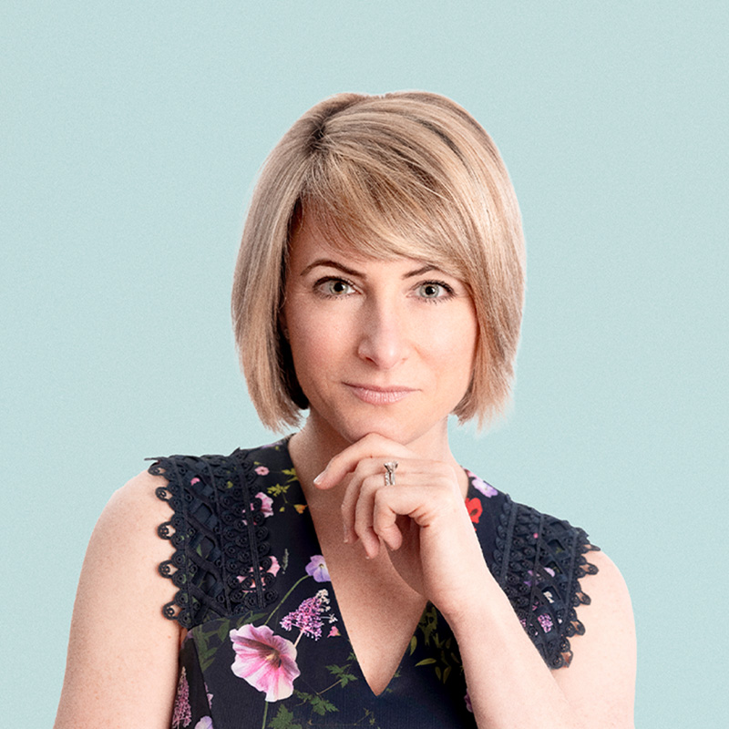 Portrait of Stacey Urry against a light background.