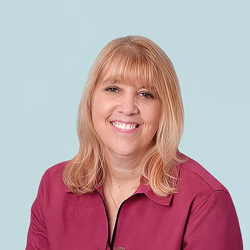Portrait of Jill Larsen against a light background.