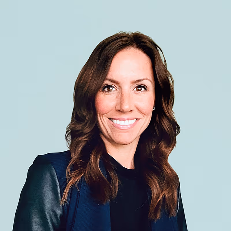 Portrait of Stacey Urry against a light background.