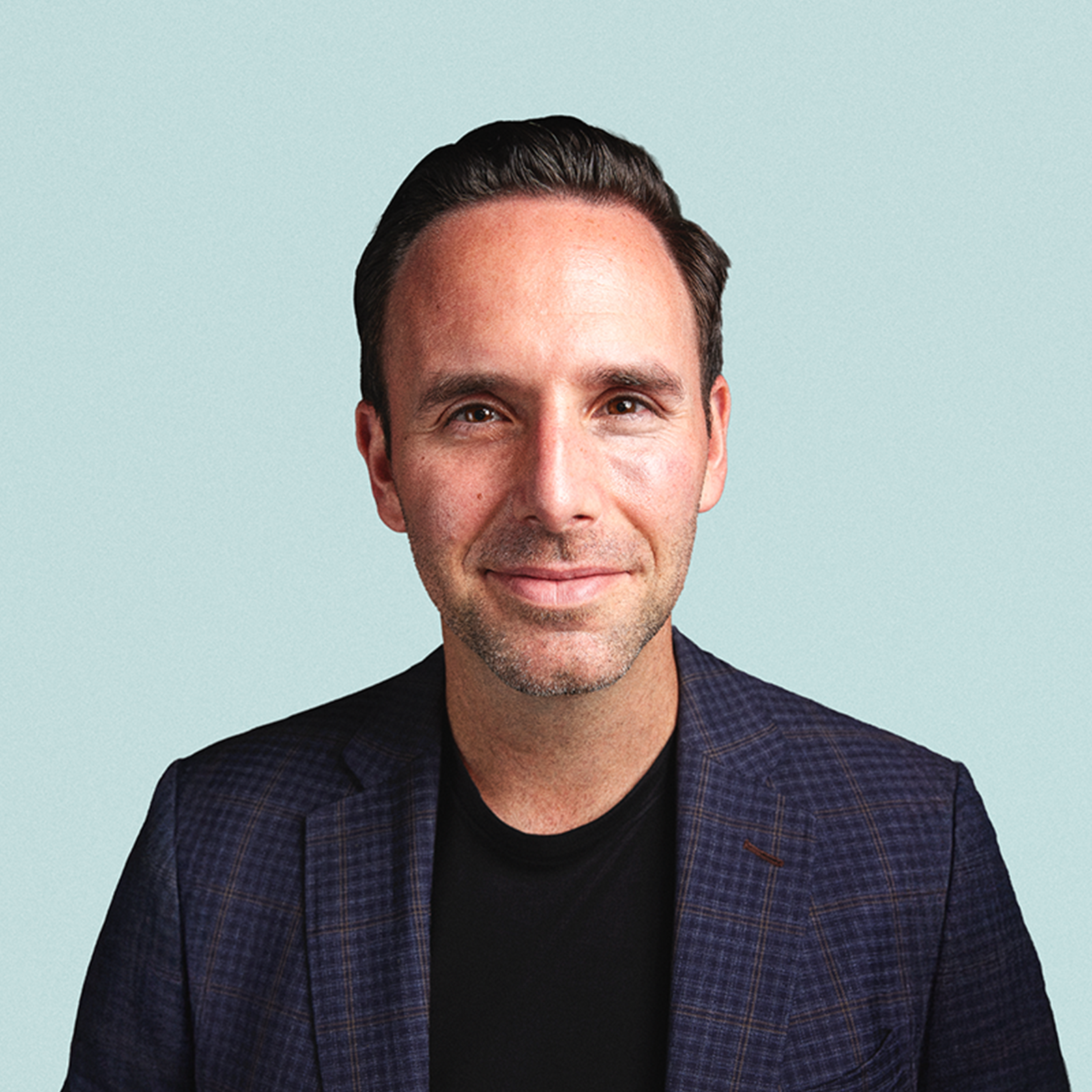 Portrait of Stacey Urry against a light background.