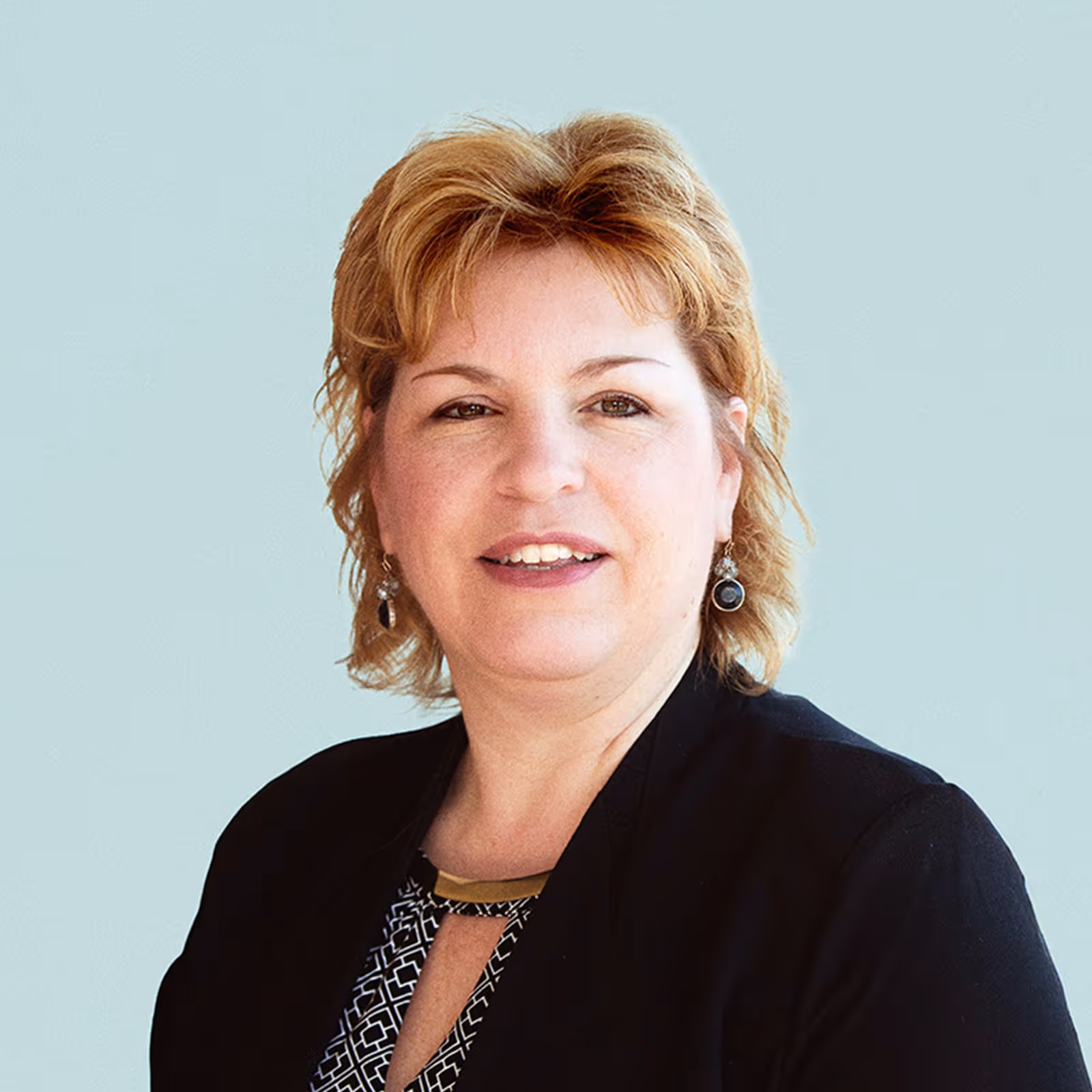 Portrait of Lori Lorenz against a light background.