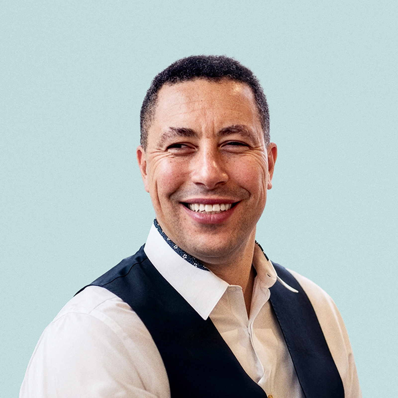 Portrait of Stacey Urry against a light background.