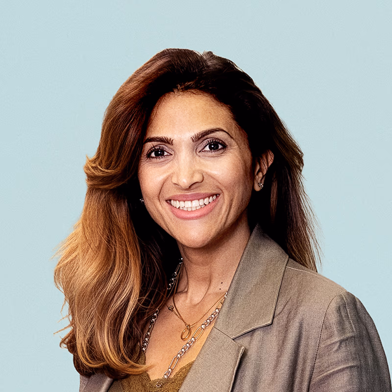 Portrait of Assil Omar against a light background.