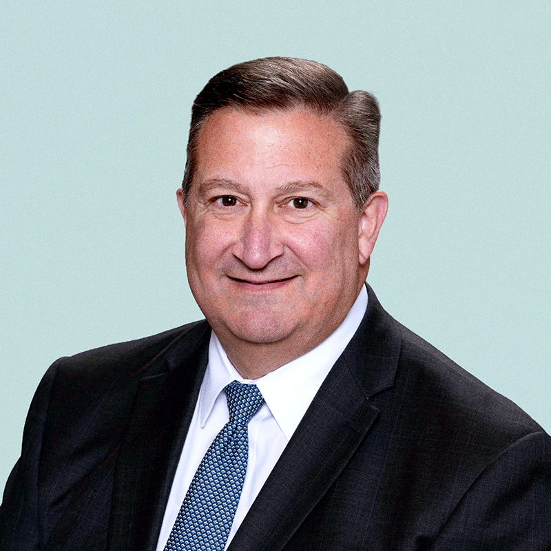 Portrait of Stacey Urry against a light background.