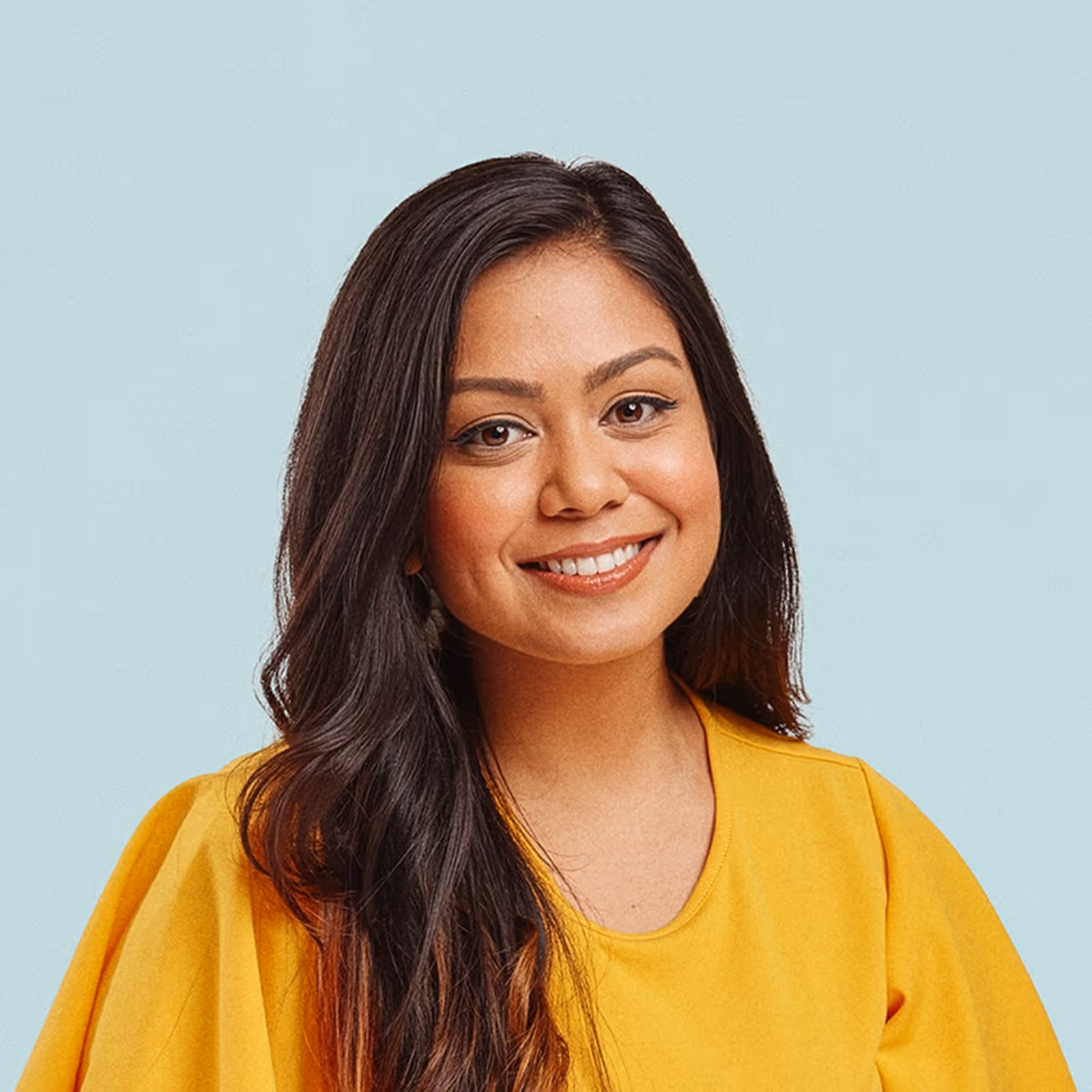 Portrait of Chandni Bennett-Kazi against a light background.
