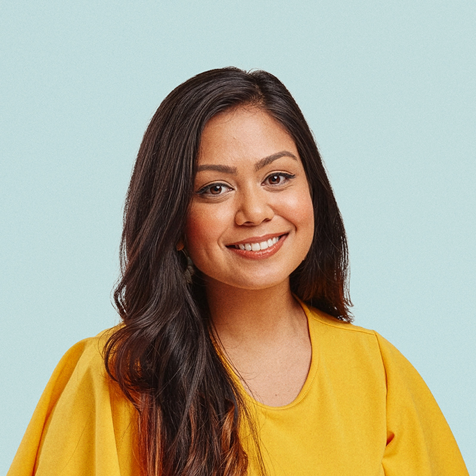 Portrait of Chandni Bennett-Kazi against a light background.