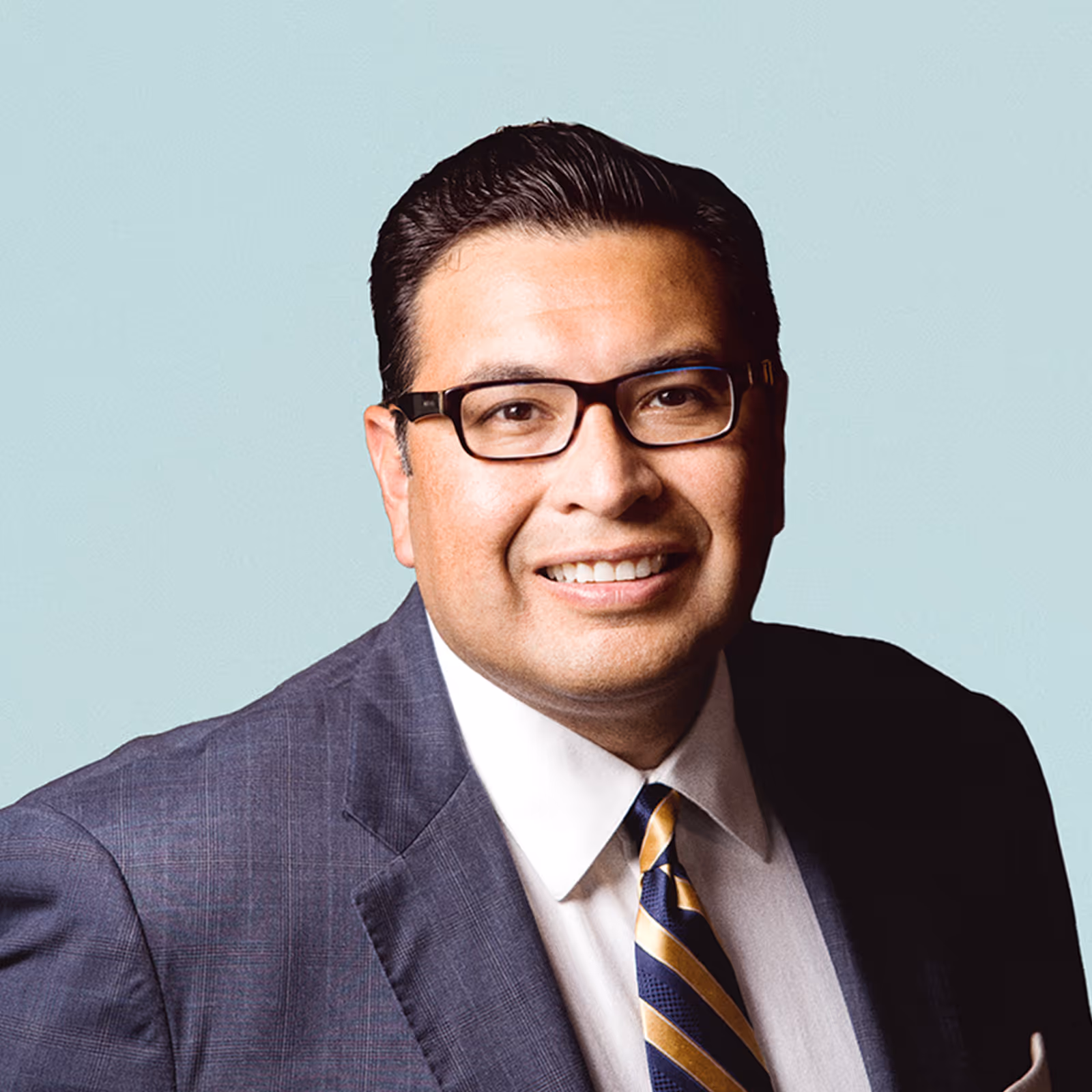 Portrait of Robert Rodriguez, PhD  against a light background.