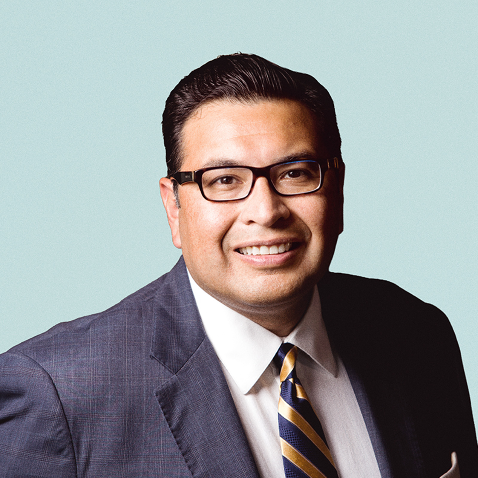 Portrait of Robert Rodriguez, PhD  against a light background.