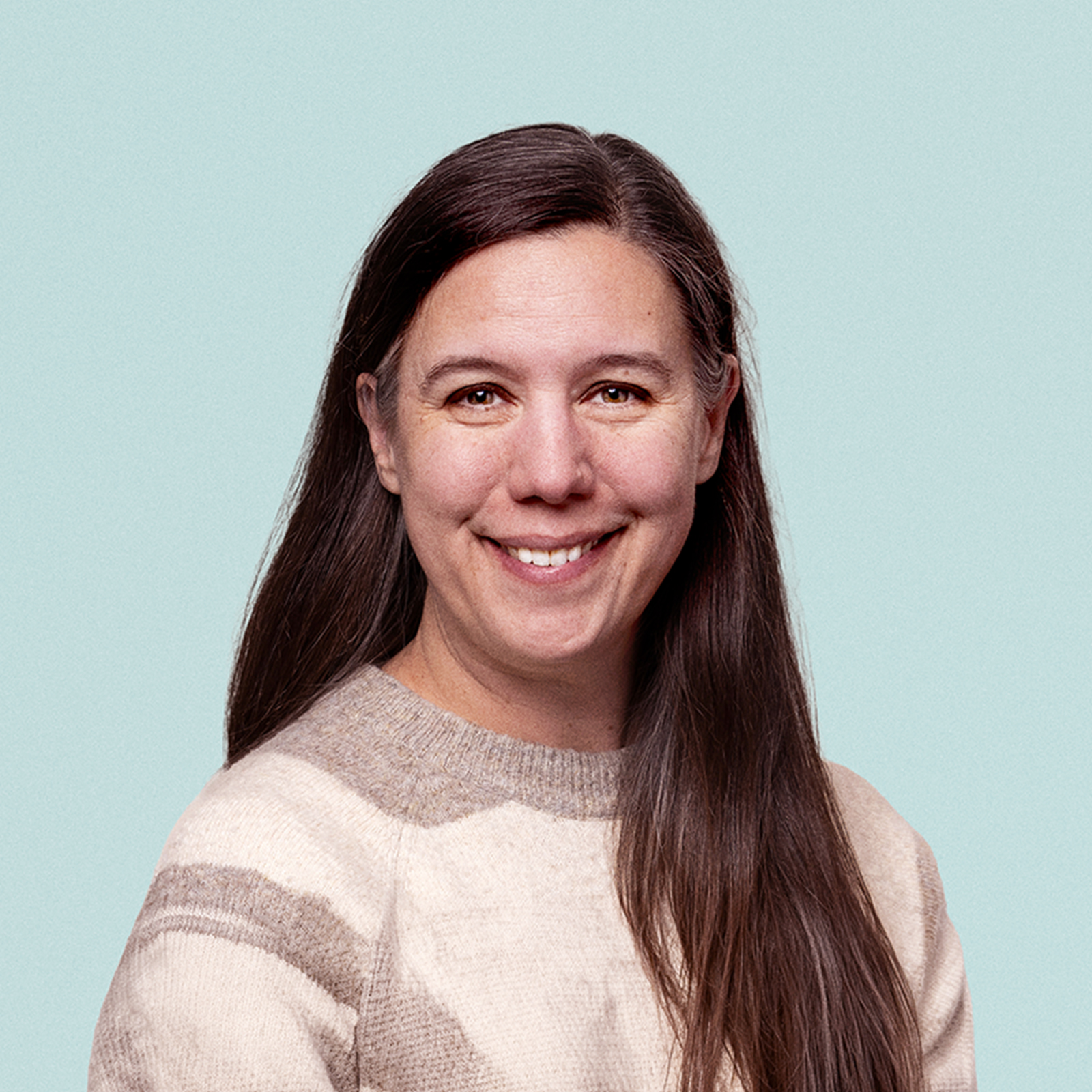 Portrait of Katie Monfre against a light background.