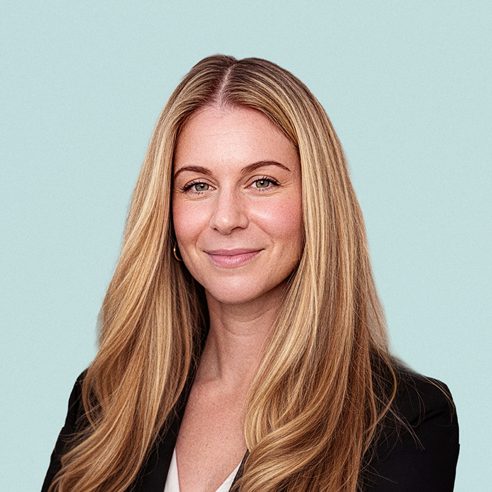 Portrait of Jackie McCarthy  against a light background.