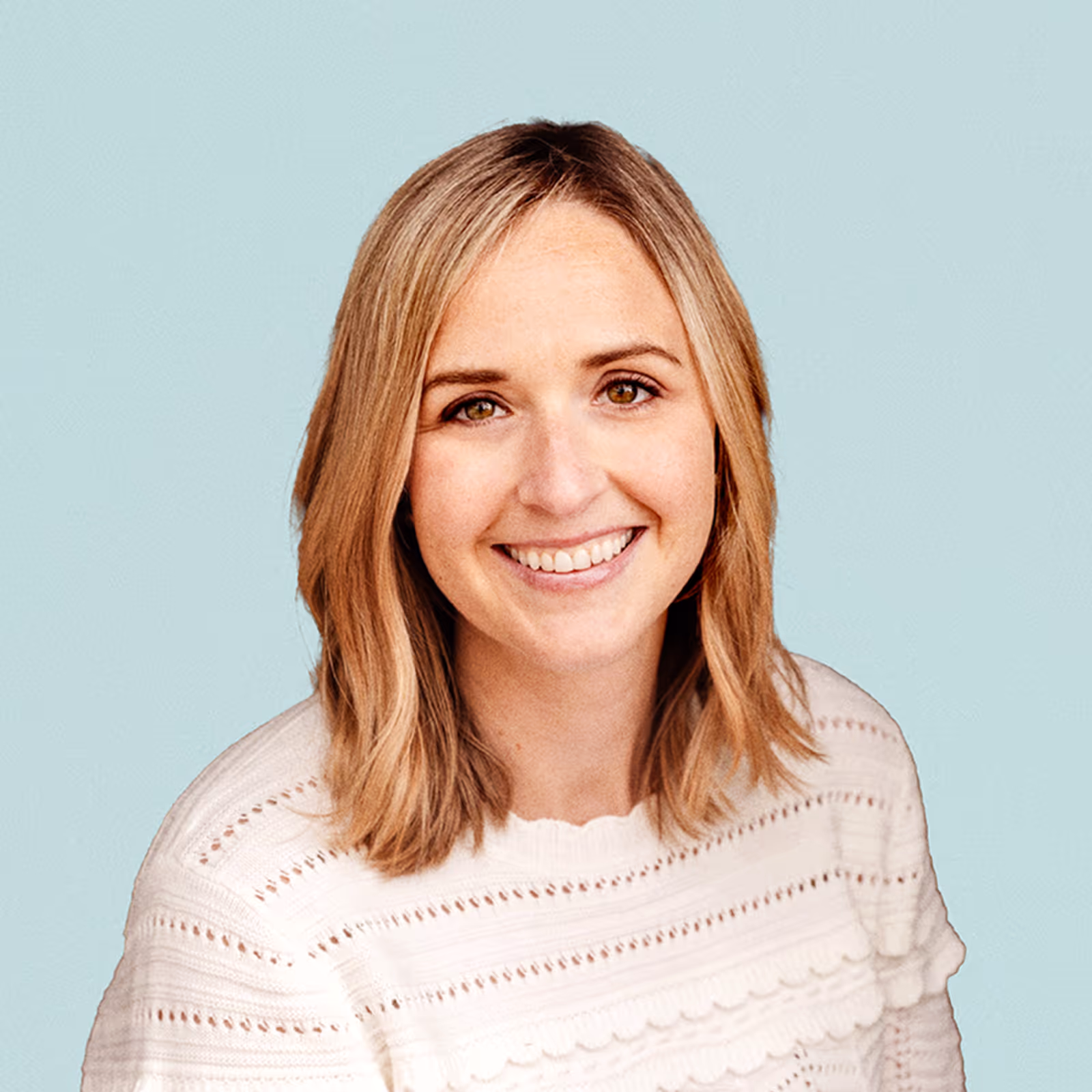 Portrait of Christine Maginnis  against a light background.