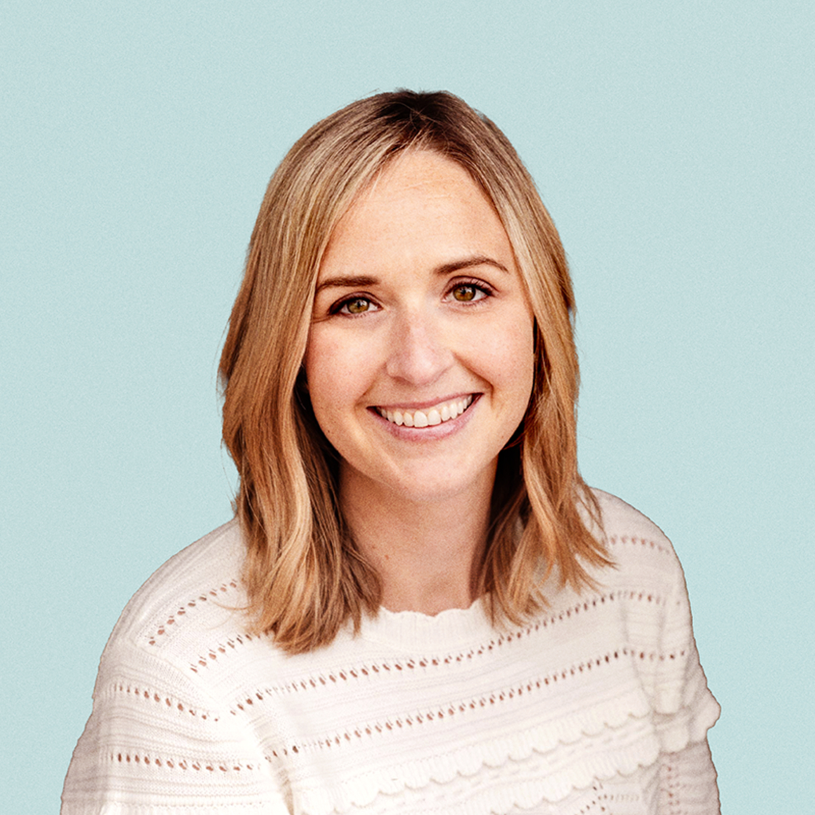 Portrait of Christine Maginnis  against a light background.