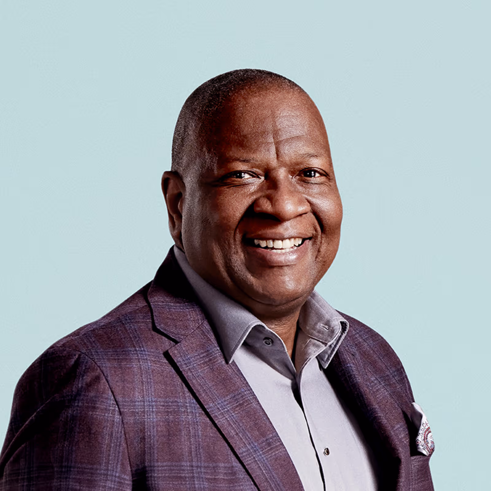 Portrait of Brian Reaves against a light background.